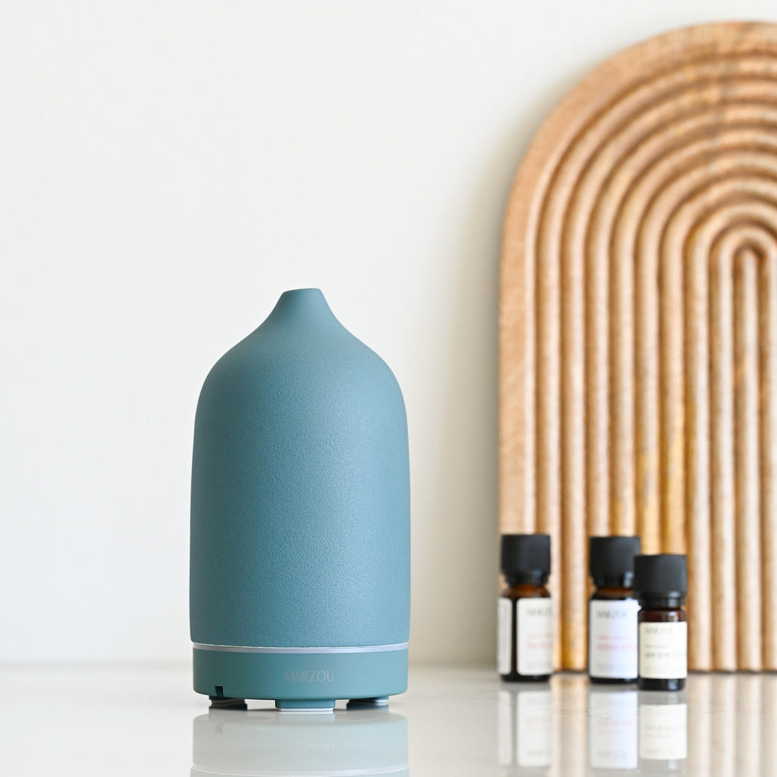 Marzou ceramic aroma diffuser ocean blue in kitchen setting with blends